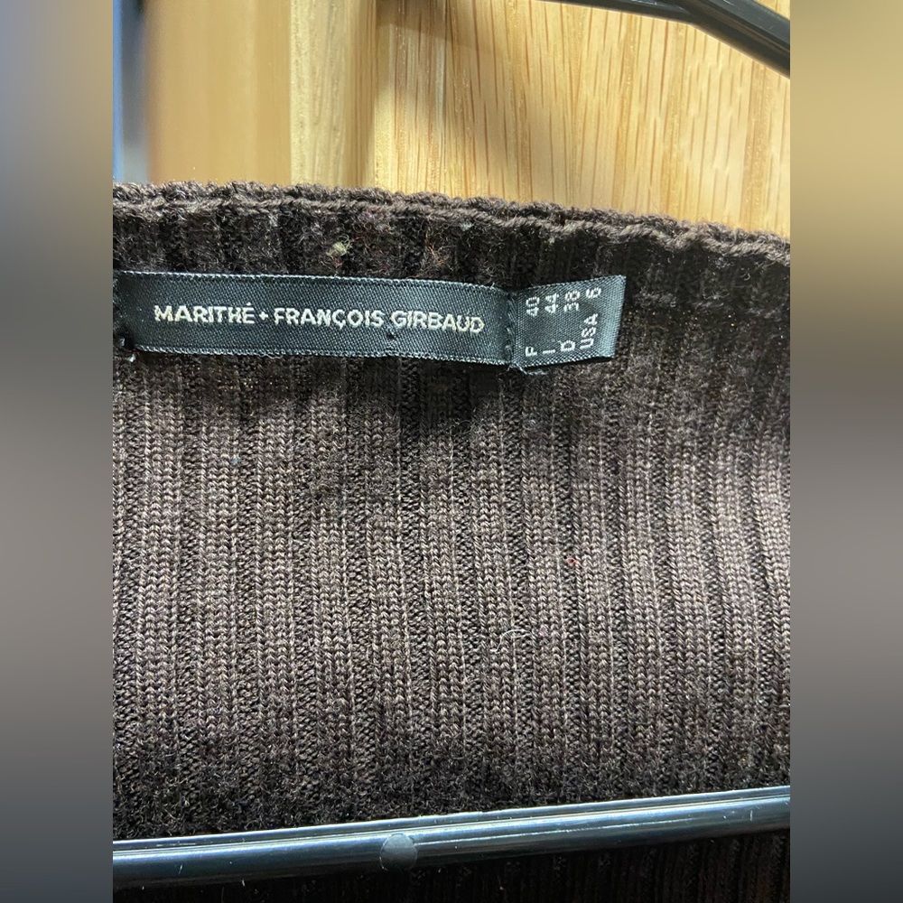 Ribbed shirt fits like a S or XS. The size is French sizing so it runs smaller.